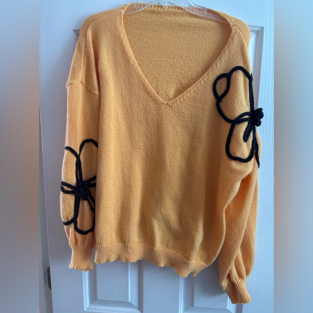 Women’s yellow sweater